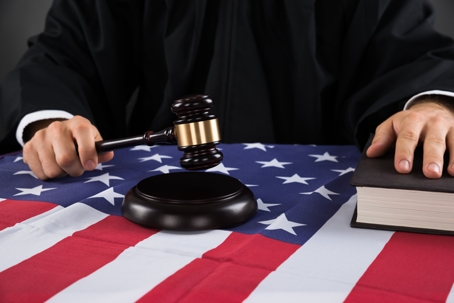 Judge with a gavel and US flag